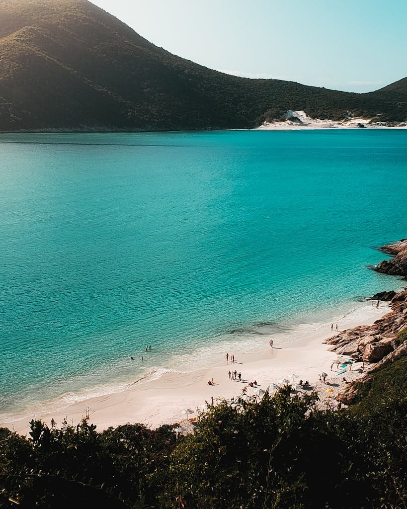 A stunning aerial view of Arraial do Cabo with turquoise waters and sandy beach, ideal for travel imagery.