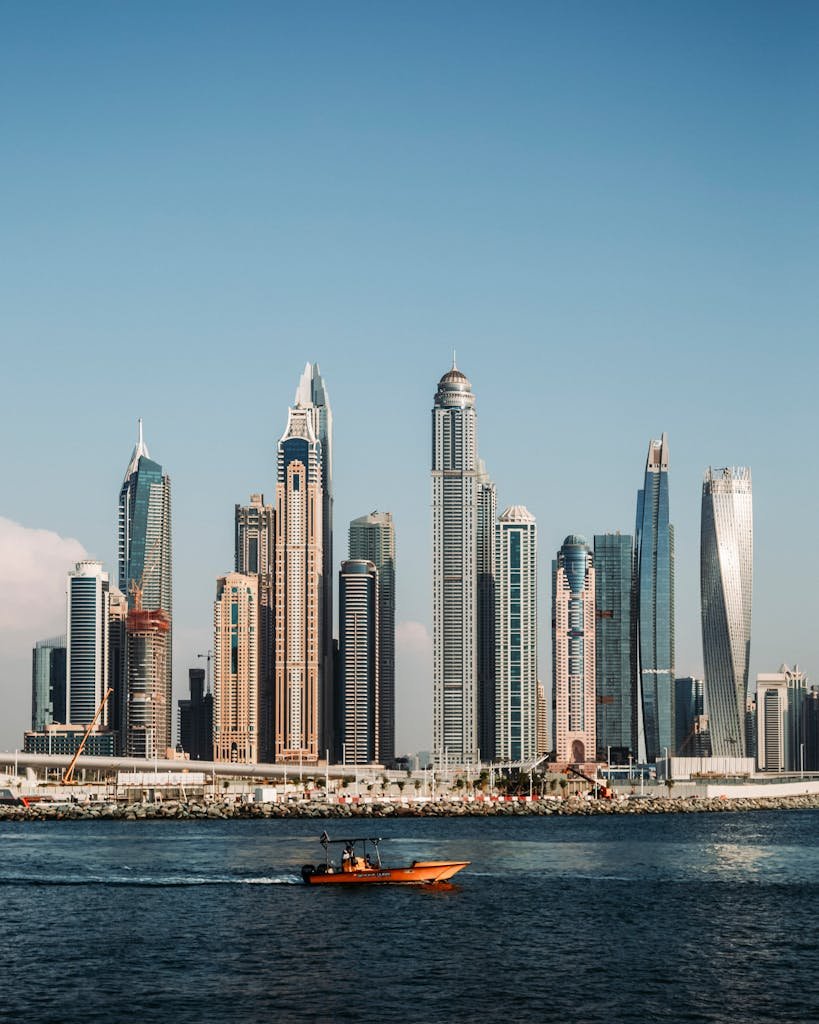 A breathtaking view of Dubai's iconic marina skyline featuring tall skyscrapers against a clear blue sky.