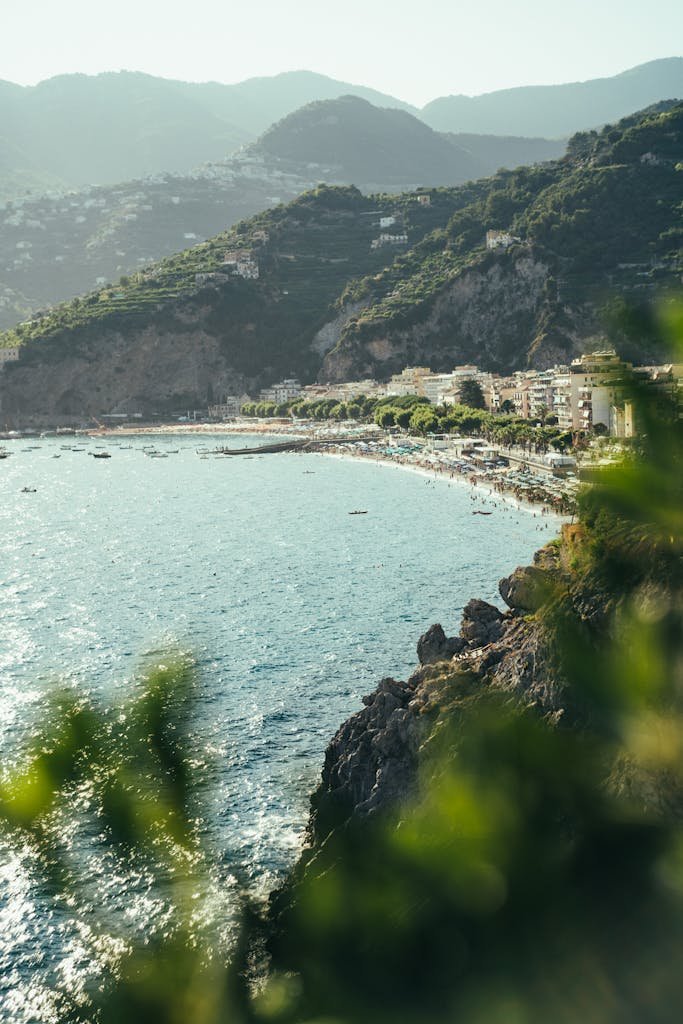 A breathtaking view of the Amalfi coastline with lush green mountains and a vibrant blue sea.