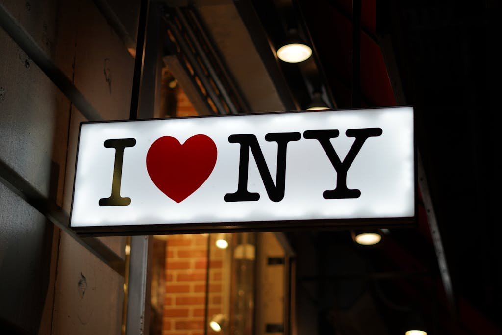 A glowing 'I Love NY' neon sign captures the essence of New York's vibrant street life.