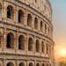 A stunning view of the Roman Colosseum at sunset, capturing the essence of historic Rome.