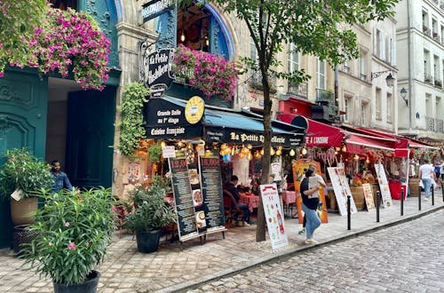 Explore Paris' charm with historic buildings and outdoor cafes.
