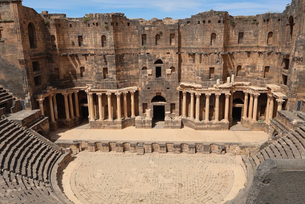 Stunning view of the Ancient Roman Amphitheater located in Bosra, Syria, a UNESCO World Heritage Site.