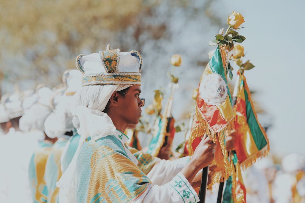 Traditional Ethiopian ceremony featuring ornate flags and vibrant cultural attire.